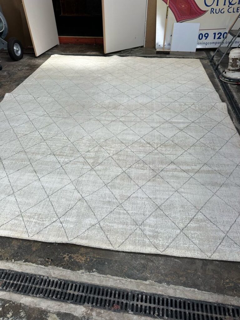 Rug with diamond pattern in an industrial environment.